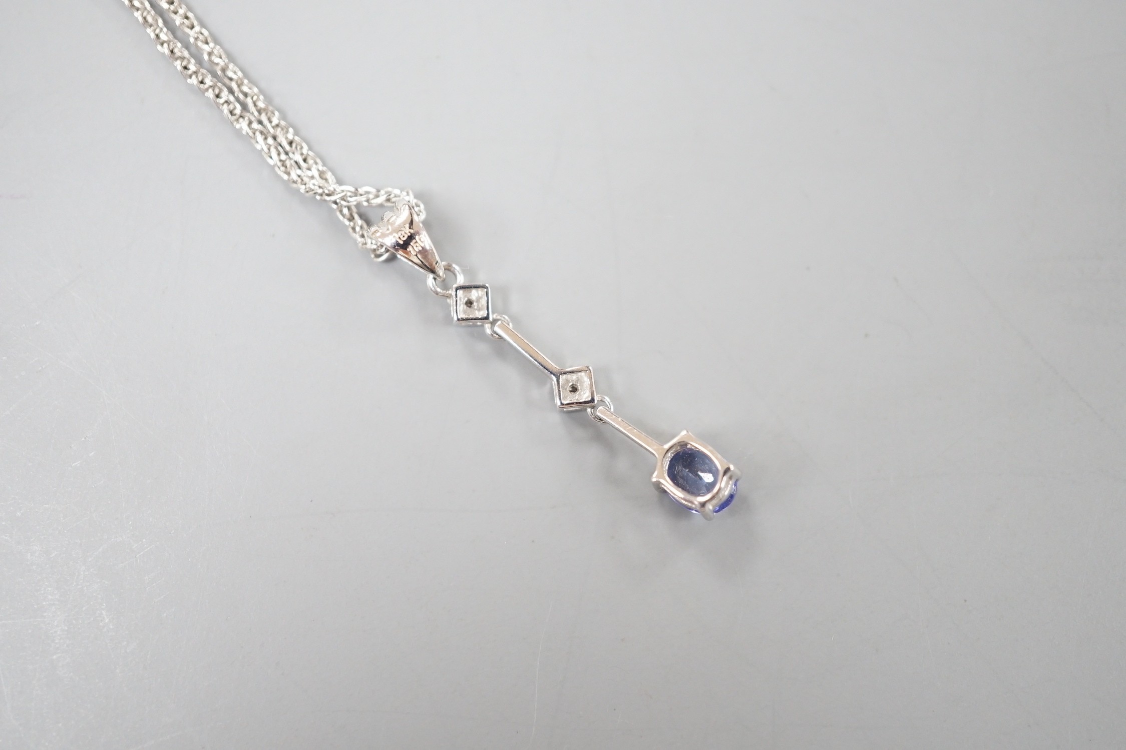 A modern Italian 705 white metal tanzanite and diamond set three stone pendant necklace, 48cm, gross weight 4 grams.